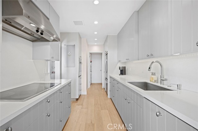 Pantry, stackable laundry and utility closet at rear