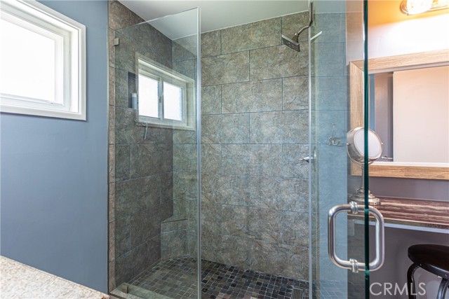 Bathroom #1 shower and vanity area.