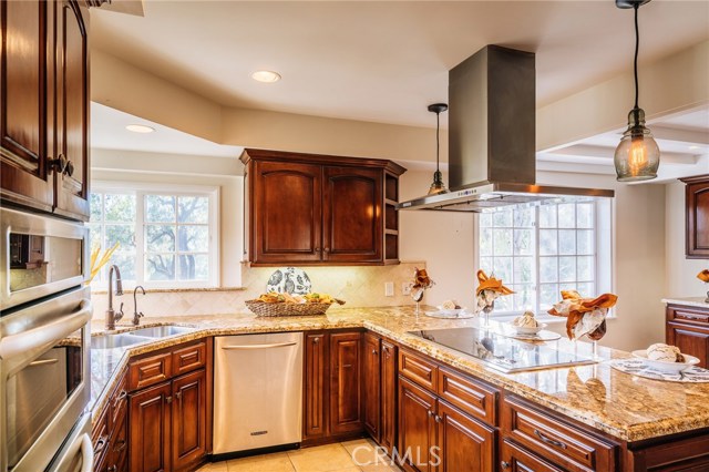 The beautiful kitchen features granite Counter tops, 5-burner Wolf range, stainless appliances, double convection oven and more.