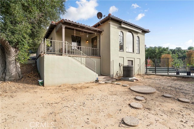 Front porch and front door. Outside basement entrance.