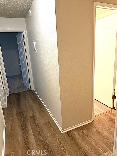 Hallway to bedrooms. to the right is the guest bathroom.