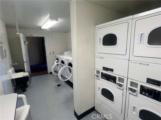 view of the laundry room from the dryers/folding area