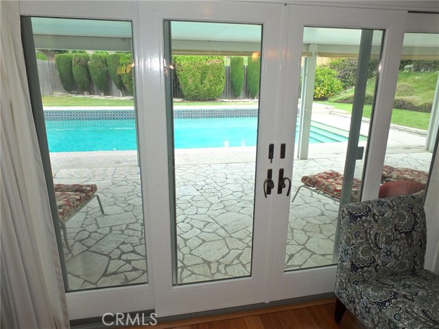 The French sliders from the den allow guests inside to participate with guests outside. The French sliders from the den allow guests inside to participate with guests outside.