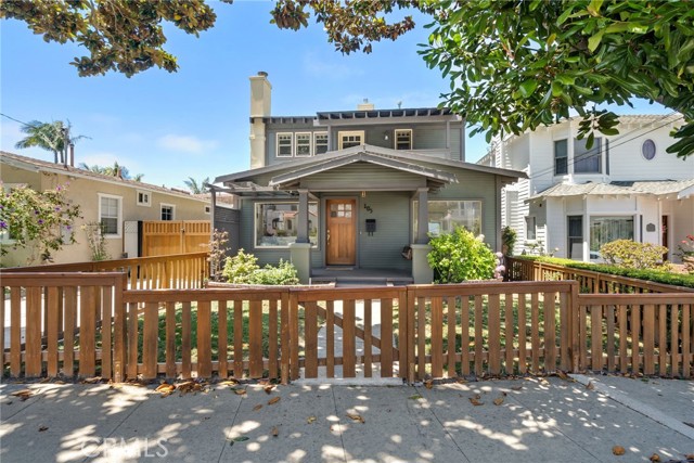 Craftsman style wood fencing and detailed gates to the backyard.