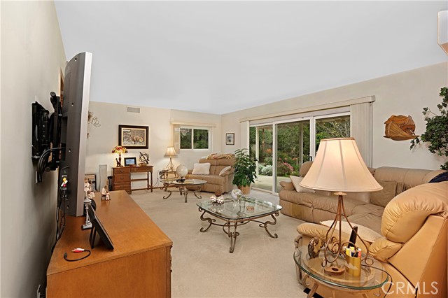 The living room is huge offering space for sitting areas in front of the 2nd fireplace and a TV viewing area.