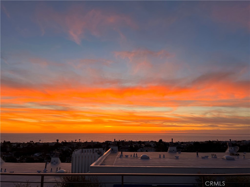 Hermosa Beach really shines in the bright blue ocean views spanning from Palos Verdes to Malibu - enjoy the first class view everyday from your balconies on Gould Avenue. Perched at the top of the Hermosa Hills, this spacious townhome is the definition of light, bright and airy. Living on the top floor is a breeze in this open-concept space featuring stunning white beamed ceilings, a lovely fireplace and ample natural light. The living room, dining area, and kitchen flow effortlessly together, leading to the massive first of two private balconies, where the ocean serves as your permanent, breathtaking backdrop. Step onto this balcony, and you'll instantly feel that this is the home where you can picture yourself starting and ending each day, standing in this very spot, taking in the same view—one you’ll never tire of. The updated kitchen features granite counters, stainless steel appliances and beachy cabinets for your beach pad. Without going too far from that view, you can tuck away into the private enclosed office towards the back of the home with a built-in desk and expansive cabinetry for storage. The first level of this townhome features three bedrooms including a large primary suite with the second private balcony. The interior of the home has been freshly painted throughout and all bedrooms have new carpet, ready for you to move in. This townhome community includes a pool and hot tub with a truly pleasant patio area surrounded by greenery and palm trees. So the choice is yours, beach or pool? Hermosa Beach is a small beach town living in a big city; enjoy quaint top quality restaurants, local shops, walking trails, plenty of parks and so much more. The monthly HOA fees include internet, spectrum cable tv, trash service, water usage, pool/spa, property landscaping and pest control and common area repairs/replacements (roof, etc.).