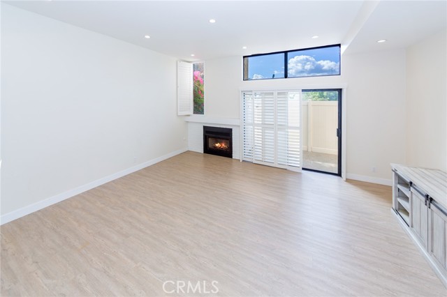 Living Room with Fireplace and door leading to Patio