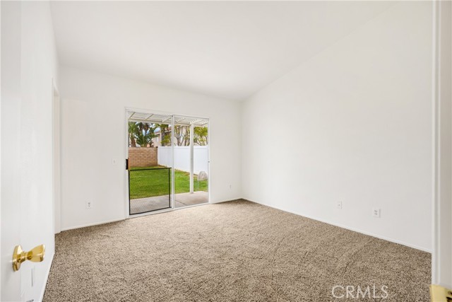 Primary Bedroom w/ attached bathroom and slider to backyard