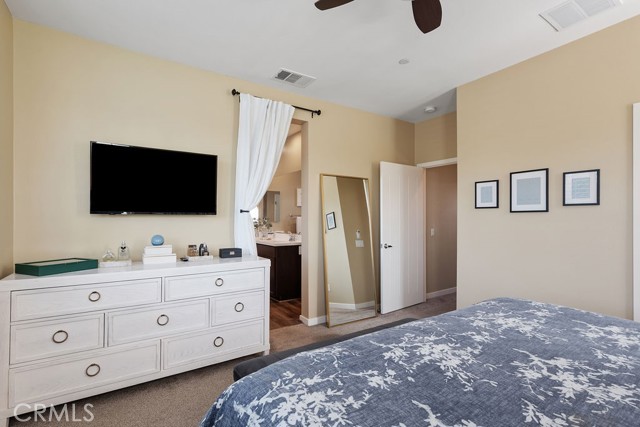Luxury primary bedroom with en suite bathroom