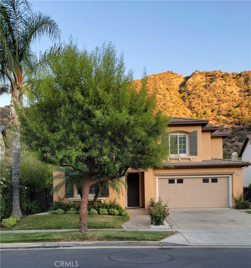 14 Silver Forest Court Azusa, California Welcome to Mountain Cove. This incredible community will take your breath away with its modern amenities and wonderful location surrounded by panoramic mountain views and beautiful natural features. Relax while listening to the river, watching birds, or exploring nature on the trails. Community amenities include an oversized sparkling pool, heated spa, playground, picnic area, clubhouse, and walking trails. This luxury 4 bedroom 3 bath home features an open floor plan with vaulted ceilings, a U-shape kitchen, a family room, and 1 bedroom downstairs next to a full bath. Upstairs, you'll find two bright and open bedrooms with a Jack& Jill bathroom, a large master bedroom and bath with his and her closet, dual vanities, a separate bathtub and a shower. This beautiful home is ideal for active people of all ages, or anyone seeking a charming and serene place to live.
