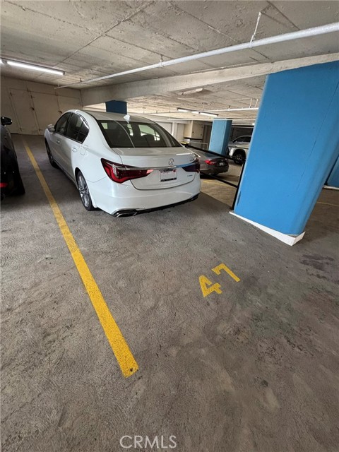 Garage tandem parking spaces 47 & 48 with 3 door garage storage in front of parking