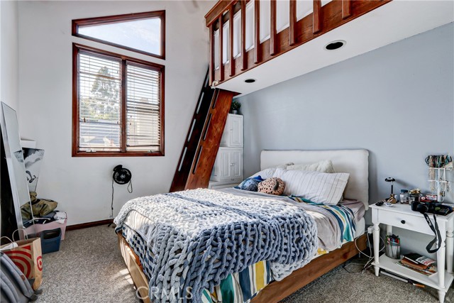 Kids bedrooms each with sleeping lofts that are...