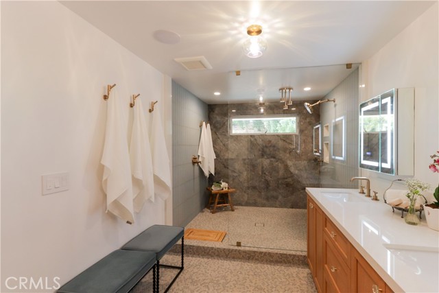 The primary suite shower is something to behold with multiple shower heads and high-end fixtures.