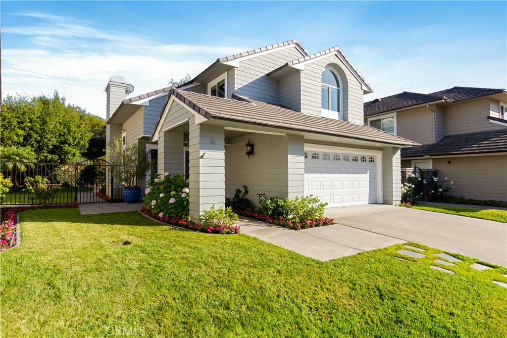 Newly upgraded with an upscale coastal aesthetic that complements its timeless Cape Cod architecture, this open and inviting home offers an outstanding turnkey opportunity in Laguna Niguel’s coveted Summerwalk neighborhood. A spacious elevated homesite nestled along a cul-de-sac street presents undeniable curb appeal, a covered front walkway, and a classic black entry door. Inside, a warm and elegant ambiance enhances a double-height foyer with graceful staircase, a living room with custom fireplace and a formal dining room that opens to the backyard. Large windows allow natural light to illuminate the residence’s many sophisticated appointments, including luxury vinyl flooring that authentically replicates wide-plank white oak, a white color theme, custom lighting fixtures, recessed LED lighting, and custom millwork complete with impressive crown and base molding, wainscoting and paneled columns. Opening to a family room that offers outdoor access, the kitchen showcases white cabinetry, a peninsula bar with custom corbels, open shelving, white cabinetry, a built-in pantry, granite countertops, tile backsplash and stainless steel appliances. Comfortably sized at approximately 2,113 square feet, the three-bedroom, two- and one-half-bath design includes an airy loft with vaulted ceiling and custom built-in shelving. Most bedrooms feature vaulted ceilings as well, including a romantic primary suite with hill views, a walk-in closet, soaking tub, and a separate shower with frameless glass enclosure. All baths shine with marble tub and shower surrounds, countertops and floors. Peaceful and private, the wraparound backyard is spacious enough for a future pool and spa and displays a paver-finished patio with open-air fireplace. Further refinements include custom paint and wallpaper, upgraded bathroom mirrors, shiplap accent walls, a pedestal sink in the powder room, and an attached two-car garage with cabinets and an epoxy floor. Summerwalk is close to award-winning schools, upscale shopping at Ocean Ranch, numerous community parks, and a trail system that leads to the beach, which is less than four miles away. Dana Point Harbor, the popular Lantern District, and Doheny and Salt Creek beaches are all just moments from home.