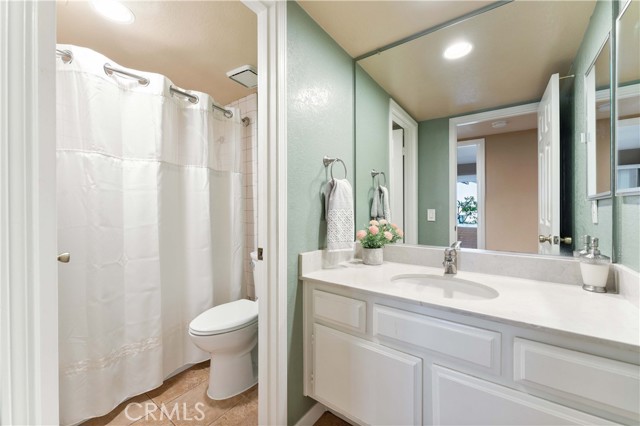 Lower level bathroom with private commode and shower in tub. Right across from the lower level bedroom.