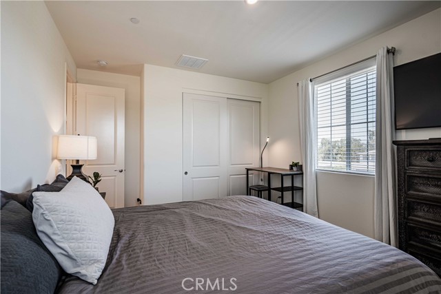 Fourth upstairs bedroom with window and closet in this picture.