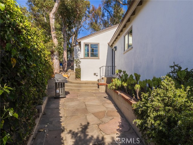 side patio off kitchen area leads to garage