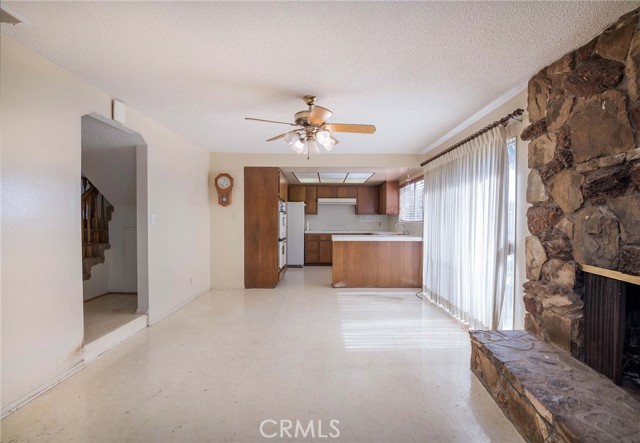 Large family room off the kitchen for family fun... over sized slider leads to the ginormous back yard!