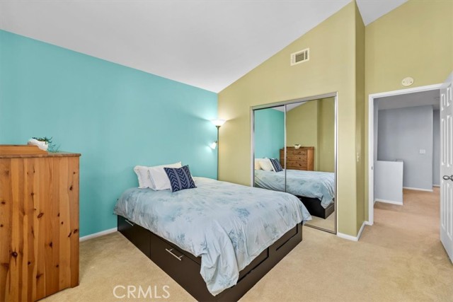 Bedroom one with mirrored closet doors