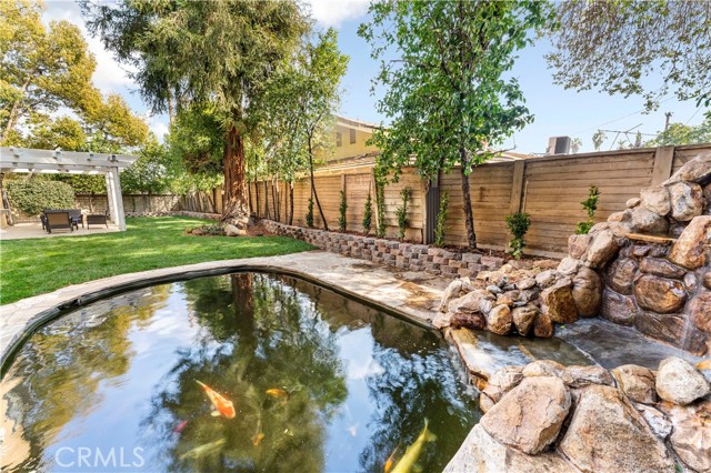 A zen garden with waterfall & pond