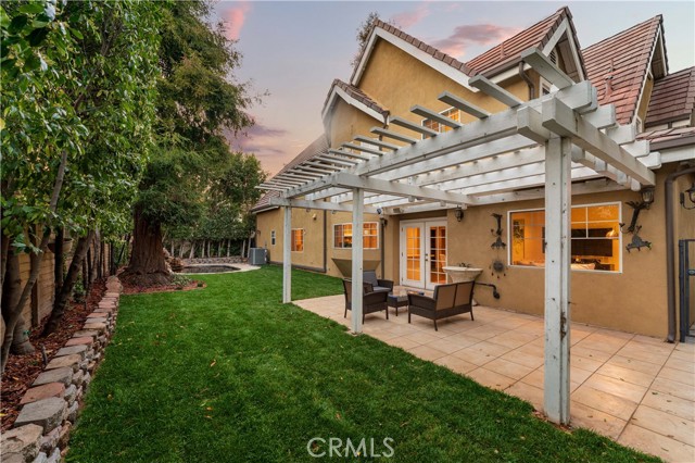  Back yard with luxuriate grass, attached patio