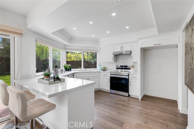 Remodeled kitchen with new Quartz counters, cabinets and stainless steel appliances.