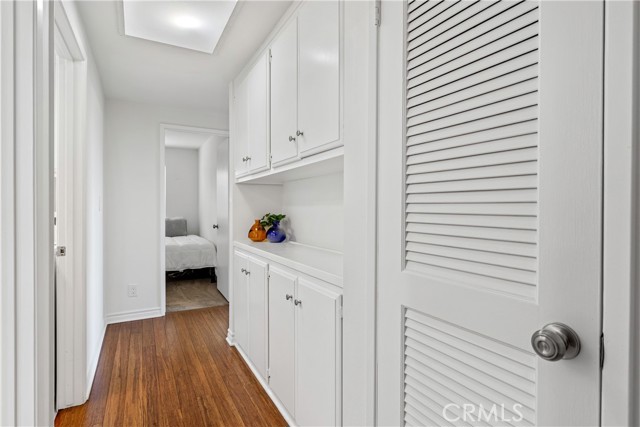 Hallway to full bath, laundry room and bedrooms.  Lots of storage.