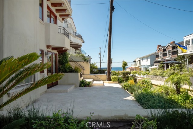 Spacious walk street patio with outdoor fireplace