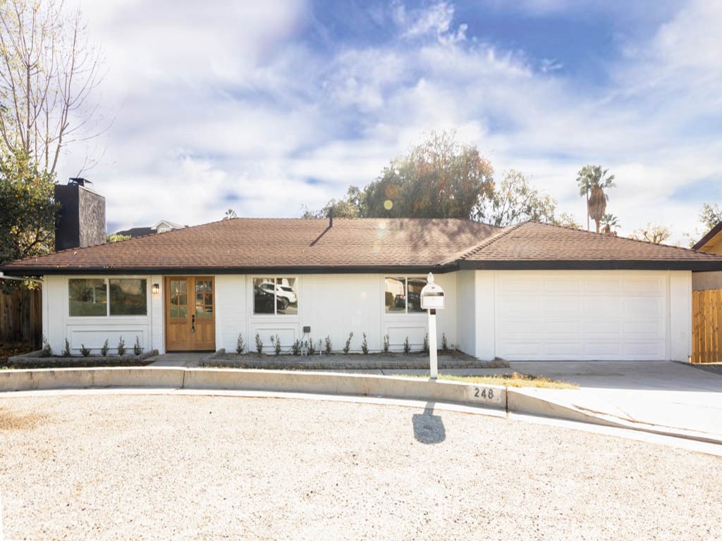 This picture perfect home is located on the corner of a quiet cul-de-sac street. This beautiful 1299 sq ft home sits on a large 8933 sq ft lot and the property boasts 3 bedrooms and 2 bathrooms. This home has been fully updated, with permits, and features an open floor plan with large windows that allow for an abundance of natural sunlight and is also adorned with recessed lighting throughout the home. The updated kitchen with full permits feature quartz counter tops, farmer's sink, brand new stainless steel appliances, and copious amounts of space for storage in the brand new white cabinets. The master bedroom is brightly lit with a chic hanging lighting fixture and is complemented with a large master bathroom that is finished with tile flooring and a modernized vanity mirror.  A large backyard that has a concrete patio area for barbecues making this truly an entertainers home. Convenient driving distance to the Rose Bowl, JPL, Old Town Pasadena, and more!