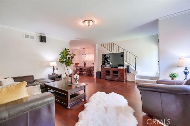 Living room with gas fireplace. Natural light.