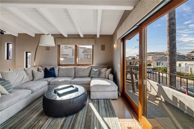 living room with attached balcony with views