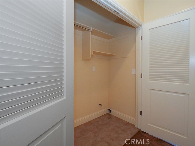 Laundry area in closet.