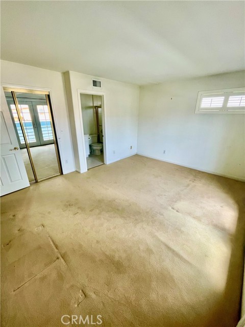 Secondary Primary Bedroom/Den/Family room, with its own bathroom and balcony