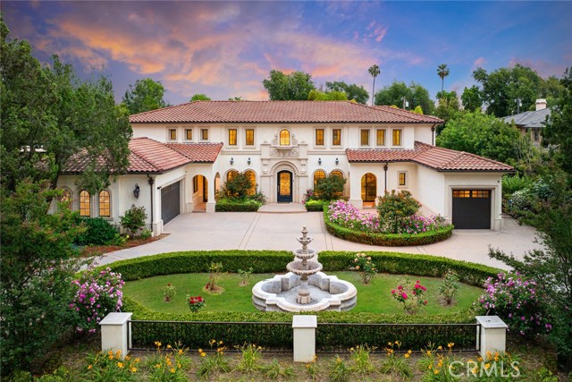 This sprawling, Mediterranean luxury estate sits on nearly an acre along one of the prettiest streets in Arcadia. The gated property has a park-like feel, with two stone fountains, two pools, landscaped flower beds, hardscaped walkways & patios, plus plenty of grass for Fido. Built in 2019, no expense was spared in the construction & design of this gorgeous 11,679 sqft home. Inside the front door, you'll find soaring ceilings, a dramatic staircase, beautiful chandeliers, custom millwork, marble tile & hardwood floors, plus huge windows that fill the space with natural light. The stunning chefâ€™s kitchen features a Wolf gas range, paneled appliances, a glass tile backsplash, marble countertops and a massive island with seating for a crowd. Thereâ€™s even a butlerâ€™s pantry with more storage and a bonus range, fridge & sink. The home is an entertainerâ€™s dream, with bars and drink stations available in nearly every gathering space. Outside, thereâ€™s a unique central courtyard with a lanai, a fireplace and dining & dancing space on the stone patio. The smaller plunge pool in the side yard feels very private and includes a waterfall. The main pool & spa in the backyard is surrounded by a patio made for lounging, with a state-of-the-art outdoor kitchen just steps away. Back inside