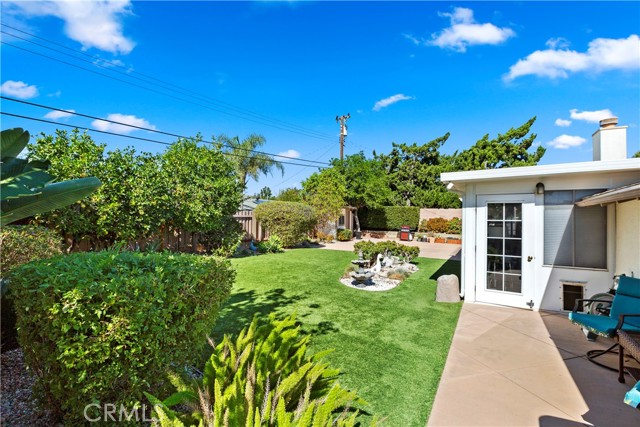 Backyard - This side patio is a great spot for a quiet conversation or relaxing as the sun goes dow