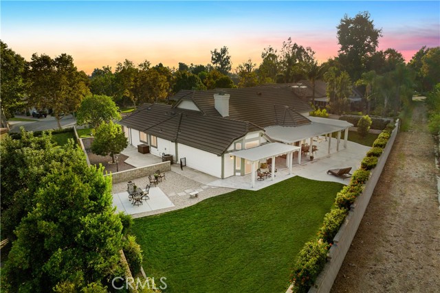Ariel view from the rear of the lot showing how expansive it is and giving you a view east side yard and bridle trail.