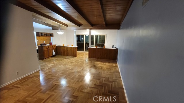 Living room, looking towards rear patio windows and kitchen.