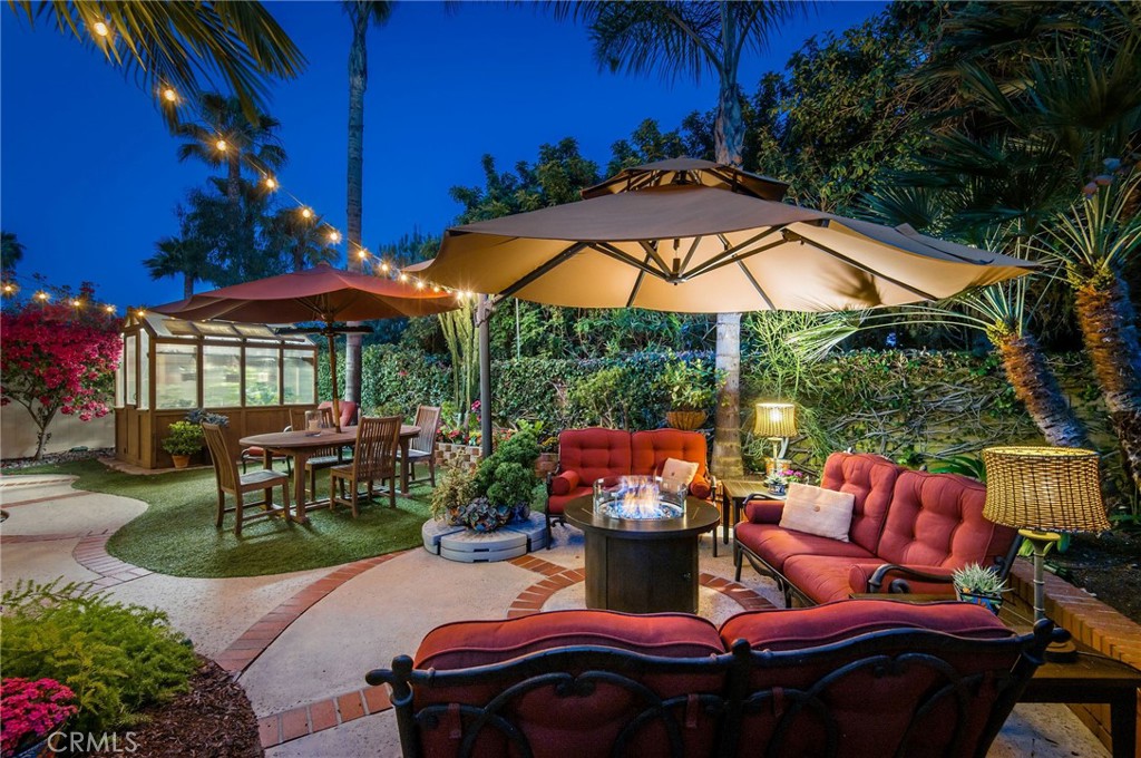 Discover coastal living at its finest in Laguna Niguel's Vista Mar neighborhood at Niguel Ranch. This prime location offers proximity to Southern California's stunning beaches and prestigious resorts like Waldorf-Astoria, Ritz Carlton, and Montage. Tucked away on a tranquil cul-de-sac street, this single-family residence ensures privacy and serenity. Every detail of this home has been carefully curated, boasting upgrades and luxury features throughout. Step through the private, gated front garden and elegant double doors into a realm of warmth and sophistication. Magnificent, vaulted ceilings and a grand staircase welcome you, while recessed low-energy LED lighting and abundant natural light create a welcoming ambiance. The remodeled chef's kitchen features new quartz countertops, stainless steel appliances, a 5-burner range, dual ovens, custom built-ins, and a breakfast bar. The adjacent family room offers a cozy gas fireplace and custom French doors leading to the meticulously landscaped backyard oasis. Retreat to the primary suite for ultimate comfort and luxury, featuring two oversized closets, a walk-in closet, custom built-ins, and plantation shutters. The completely remodeled primary bathroom is a spa-like sanctuary, boasting a rainfall shower, separate soaking tub, dual sinks with upgraded hardware, quartz countertops, and smart mirrors. Upstairs, three guest bedrooms with mirrored wardrobes and custom loft space provide ample space for guests or family members. The remodeled guest bathroom features all-new fixtures, cabinets, tile, and flooring, along with a luxury shower and smart light with USB speaker. Additional highlights include engineered wood flooring downstairs, luxury vinyl floors upstairs, a laundry room with custom cabinets and an oversized sink, and a 3-car garage with off-street parking for 6 cars. Enjoy the convenience of living in the Niguel Ranch Community, with access to parks, trails, tennis courts, sports courts, playgrounds, and top-rated schools. With its prime location and unparalleled amenities, this property epitomizes the ultimate Southern California lifestyle.