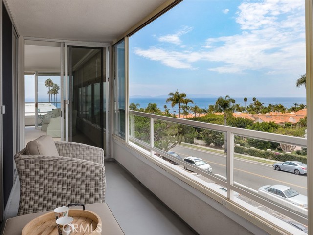 Second generously sized balcony enjoying stunning ocean, Catalina, and neighborhood views with direct sliding door access from living room, primary bedroom, and second bedroom.