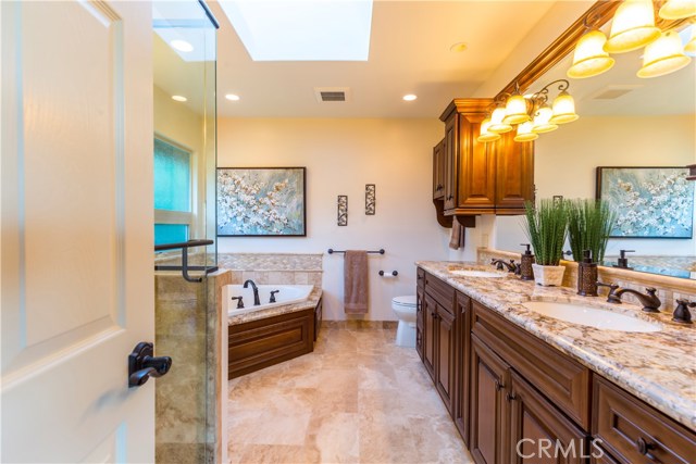 Indulge in a little pampering in the master bathroom with oversize shower and spa tub.