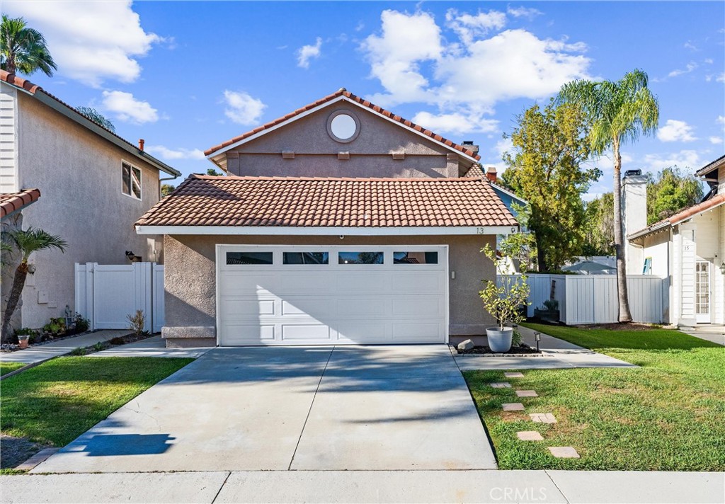 Welcome to this charming home nestled in the serene Niguel Ranch community with a low HOA of $38. This beautifully updated 3-bedroom, 2.5-bathroom residence is located in a quiet neighborhood, perfect for peaceful living. As you step inside, you'll be greeted by a spacious, light-filled downstairs living area that boasts stunning engineered wood floors, crown molding,  and cozy fireplace. The open and bright layout creates a welcoming atmosphere, with the dining room overlooking a private backyard. While the sprinkler system in both the front and back yards ensures easy upkeep of your outdoor spaces, this backyard is designed for low maintenance, featuring artificial turf and an open patio ideal for relaxing or entertaining. The country-style family room is adjacent to an updated kitchen, complete with self-closing cabinets, quartz countertops, and modern glass and stone tile backsplash. The kitchen is both stylish and functional, with stainless steel appliances, making it a perfect spot for culinary adventures. The home is equipped with dual pane windows and has been fully re-piped with PEX piping for your peace of mind. Retreat to the primary bedroom, which features high ceilings, a ceiling fan, roomy layout, walk-in closet and a spacious en-suite bathroom with quartz dual sinks. For added convenience, the home includes an inside laundry area. The garage offers ample overhead storage and an epoxy floor. Enjoy the best of coastal living with easy access to downtown Dana Point, the Harbour, Laguna Beach, shops and restaurants. Additionally, the home is within walking distance to a school and parks, enhancing its friendly appeal. Don't miss this opportunity to make this lovely Laguna Niguel home your own, and experience the perfect blend of comfort and convenience.