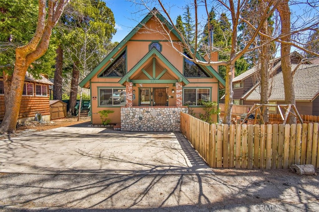 Welcome to 371 Maple Dr. in beautiful Lake Arrowhead! This stunning property offers a fantastic living experience with its spacious layout, modern amenities, and convenient location. Here's a detailed description of this exceptional home:Situated in the charming Lake Arrowhead area, 371 Maple Dr. is a magnificent residence boasting four bedrooms and three bathrooms, perfect for accommodating a family or hosting guests. With a loft den and open concept living, kitchen, and dining areas, this home provides ample space for relaxation and entertaining.As you step inside, you'll immediately notice the inviting atmosphere created by the open layout. The living room seamlessly flows into the kitchen and dining area, creating a cohesive space for socializing and spending quality time with loved ones. The abundance of natural light floods the interior, enhancing the warm and welcoming ambiance.The kitchen has been tastefully updated, featuring modern appliances, sleek countertops, and ample storage space. Whether you're a seasoned chef or simply enjoy cooking, this kitchen will cater to all your culinary needs.The property boasts two bedrooms with en suite bathrooms, offering privacy and convenience for residents and guests alike. These well-appointed bedrooms provide a comfortable retreat, allowing everyone to unwind and recharge after a long day. Additionally, the remaining two bedrooms share a spacious and well-appointed bathroom.One of the major highlights of this property is its proximity to the lake. Within walking distance, you can easily access the serene lake, allowing you to enjoy a variety of water activities, including swimming, boating, and fishing. The tranquil surroundings offer a peaceful escape from the hustle and bustle of daily life.Furthermore, this home is conveniently located just minutes away from shopping centers and restaurants. Whether you're looking to run errands or explore local dining options, you'll find everything you need within a short distance.In summary, 371 Maple Dr. in Lake Arrowhead presents an exceptional opportunity to own a beautiful and well-maintained property. The added benefits of air conditioning, proximity to the lake, and convenient access to shopping and dining make it an even more desirable option. Don't miss the chance to make this wonderful property your new home!