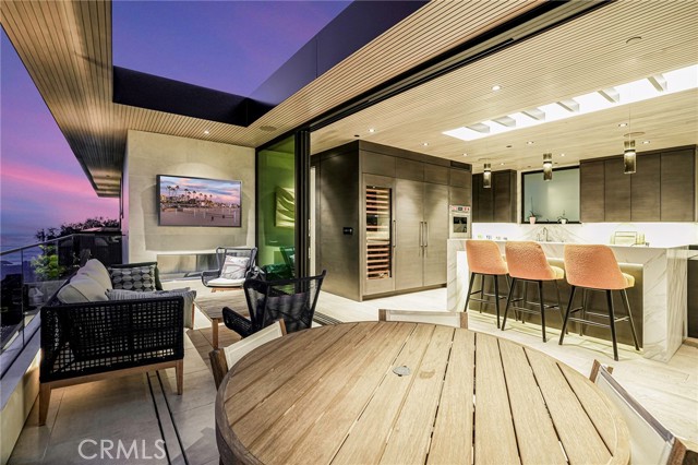 Twilight view of deck looking into the kitchen