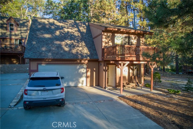 Two car garage with two car parking in front
