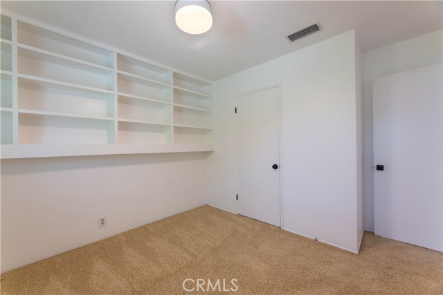 Bedroom 3 with built in shelves