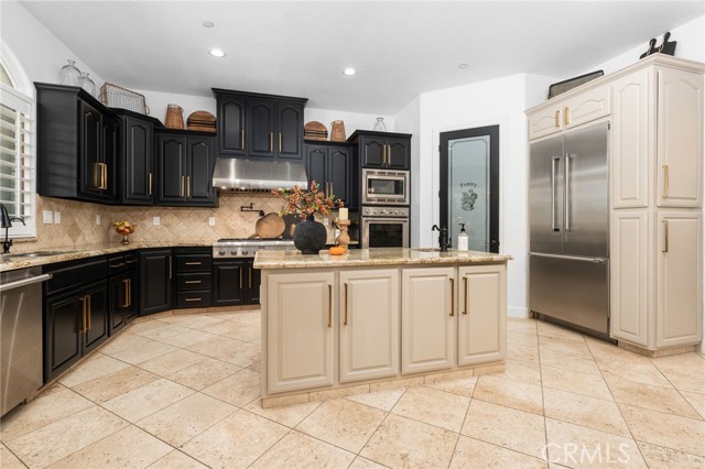 Cook's kitchen with an additional island, premium Thermador appliances, built in refrigerator,