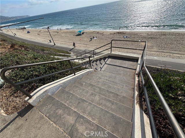 Steps from building to beach