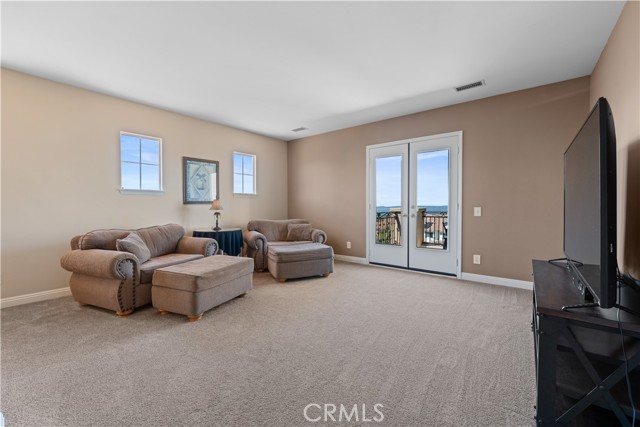 Another great sitting area. French doors lead you to a beautiful deck with amazing views!