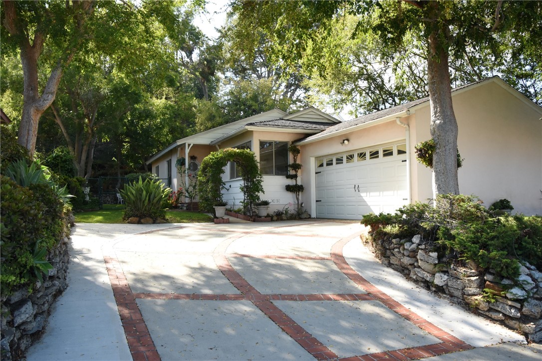 Lovely curb appeal with shady Chinese Elm trees surrounding!