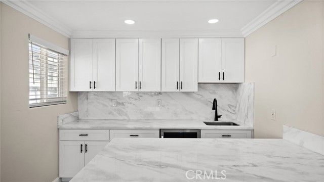 Wet Bar with under cabinets LED lights under cabinets, beverage/Wine Cooler and bar counter.